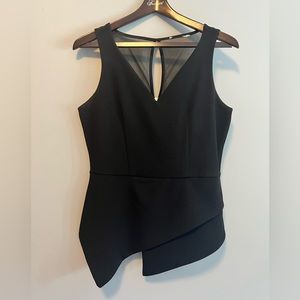 Asymmetrical black top. Mesh shoulder and upper back.